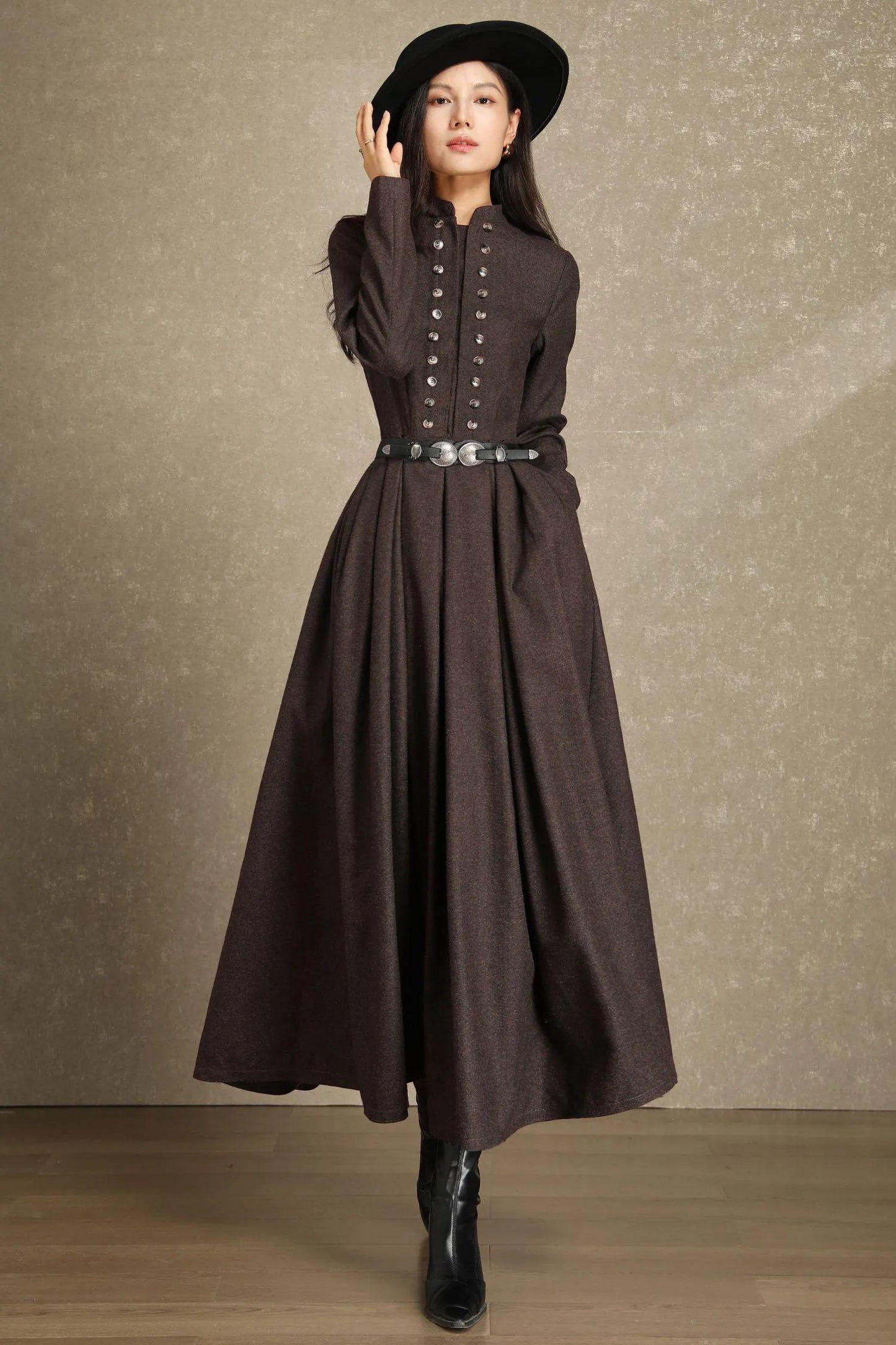 Front view of brown wool dress with ornate button detailing and mandarin collar