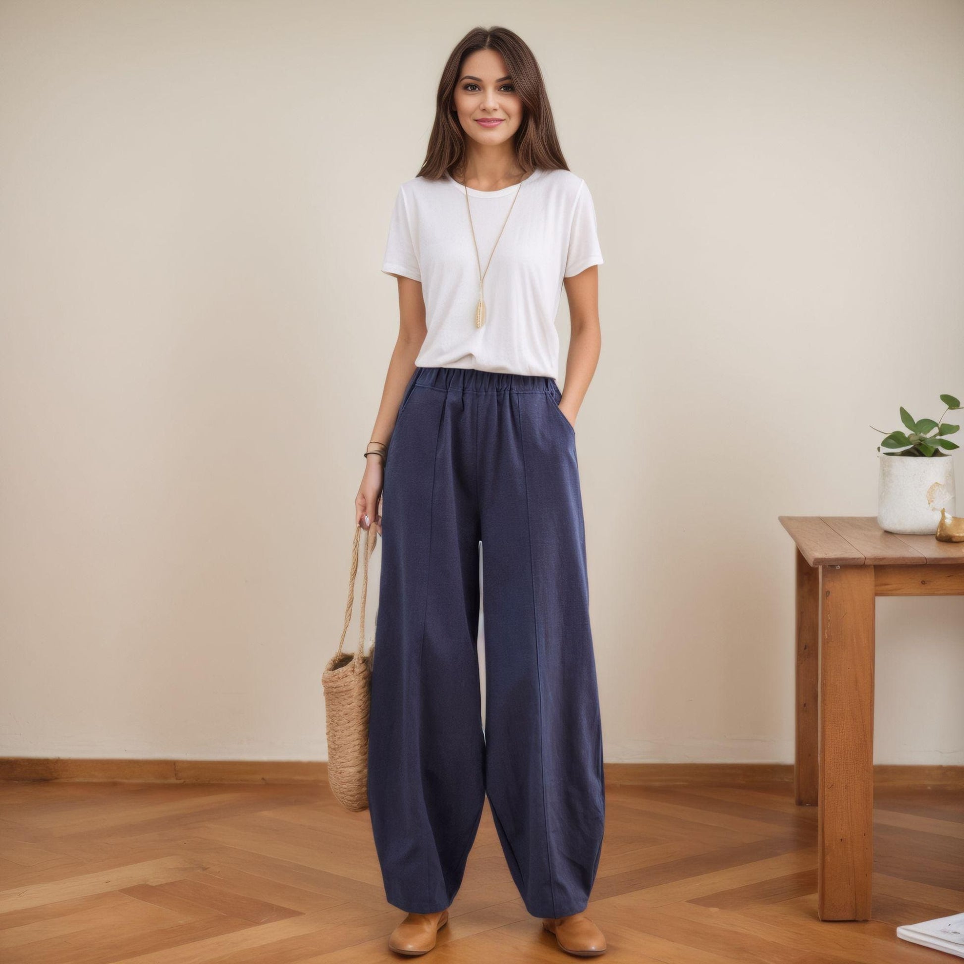 May include: A pair of wide-leg, dark blue pants with a drawstring waist and pockets.